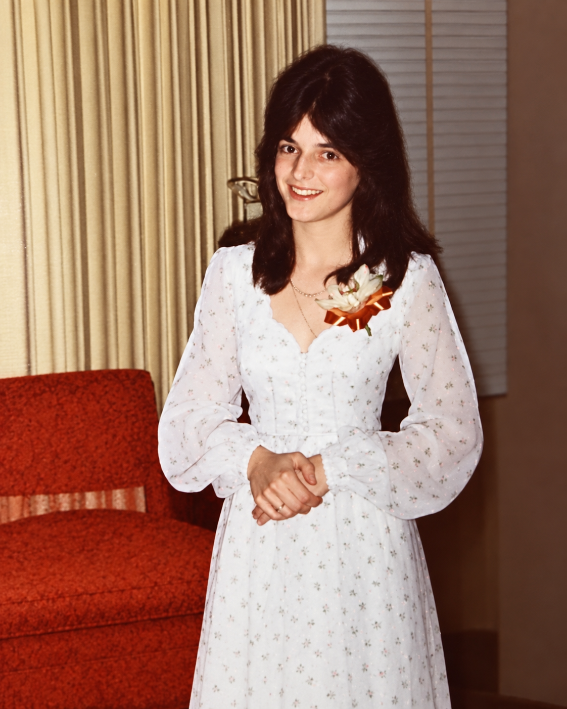 Mary as a teenager in an ivory dress with a corsage